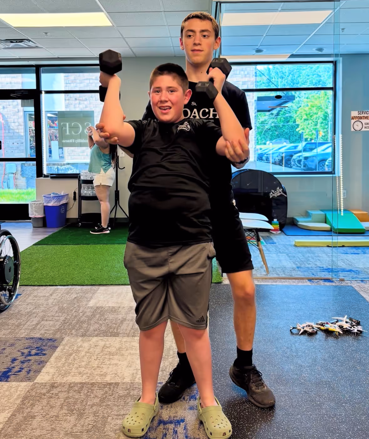 Child client with disability training in Saint Christopher's Fitness
