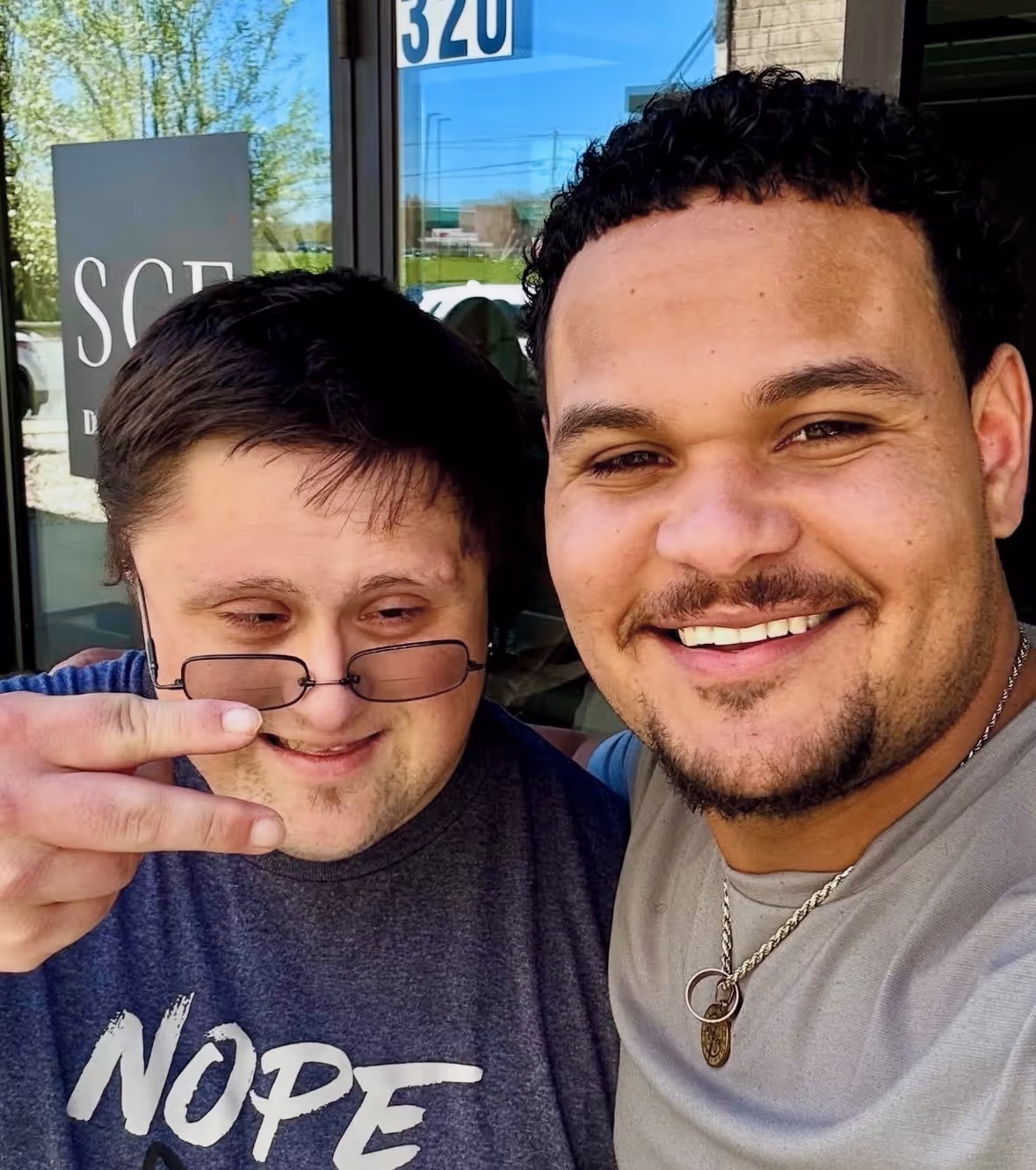 Jomilson Alvarez and client outside of Saint Christopher's Fitness